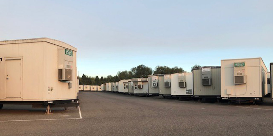 modular offices lined up on display at the WillScot Portland, OR office