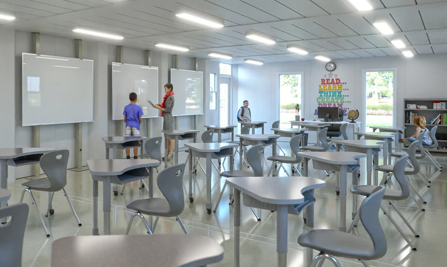 Internal shot of classroom module with desks and whiteboards
